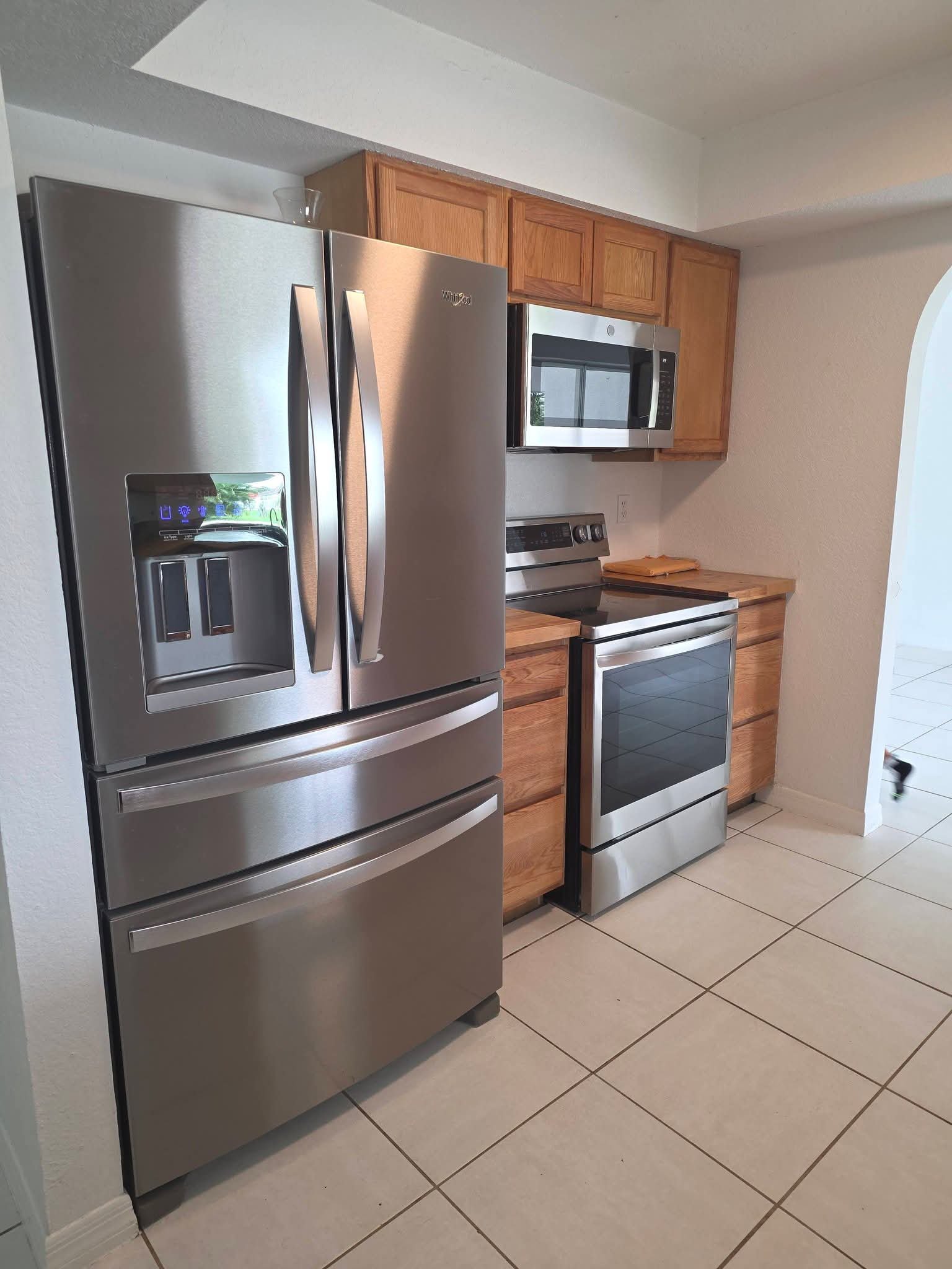 Stainless steel refrigerator and range, fingerprint-free
