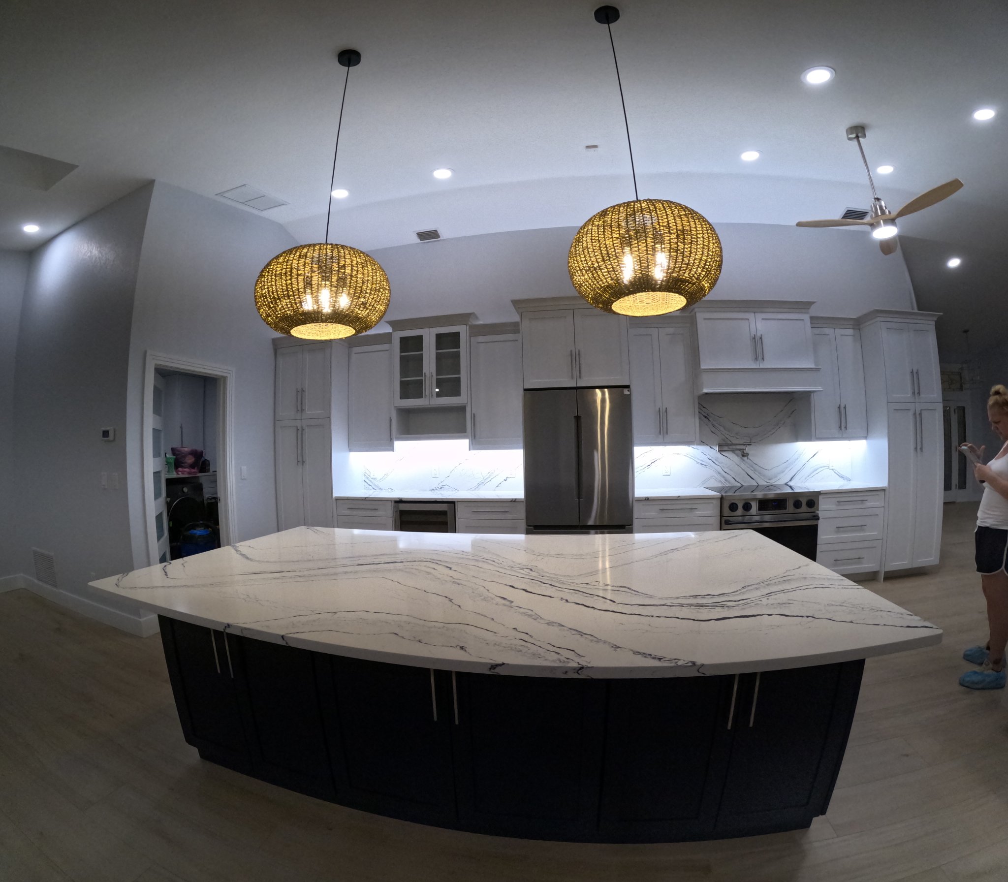 Modern kitchen with marble island gleaming after cleaning