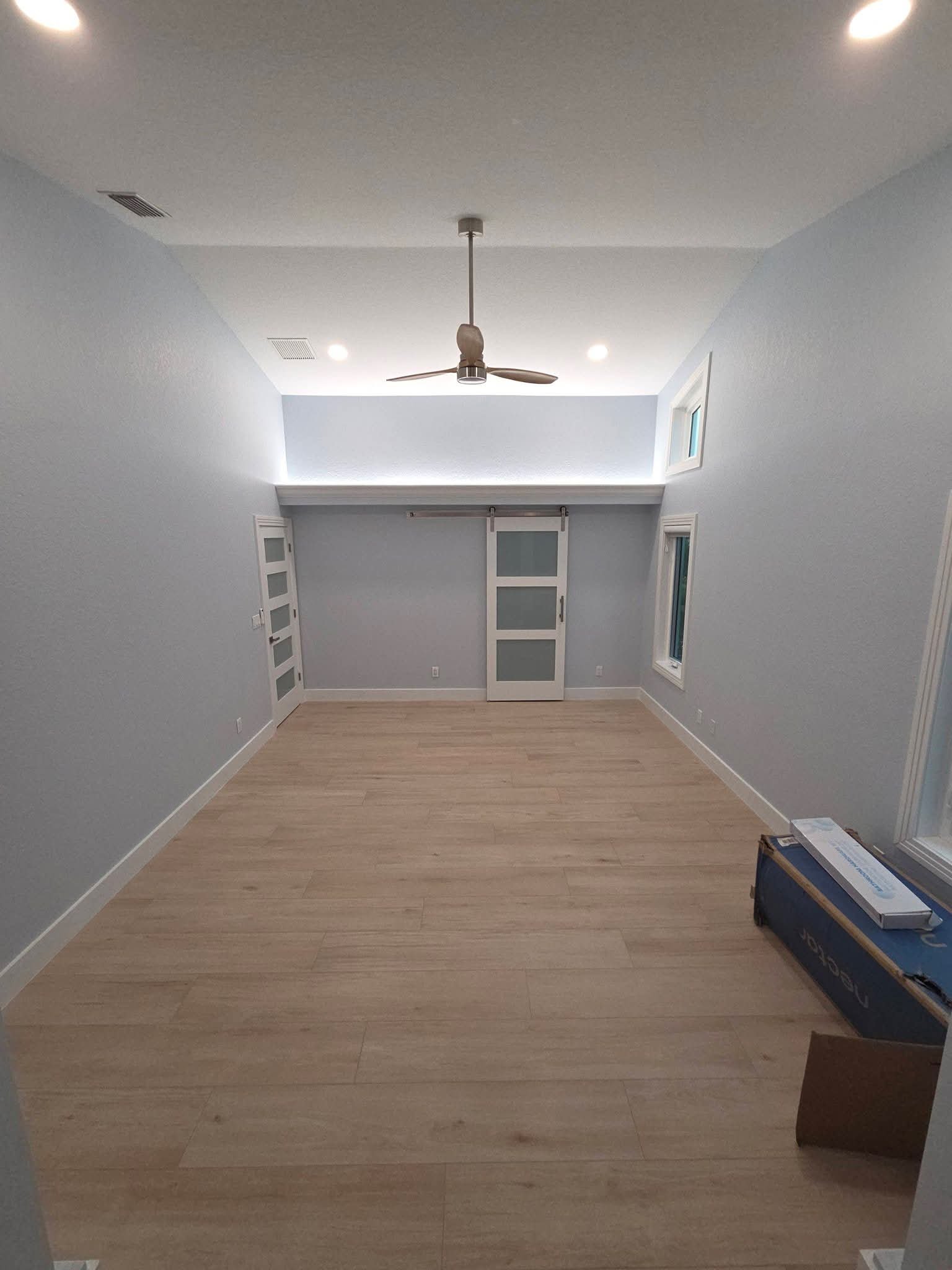 Empty room with spotless floors after a move-out clean