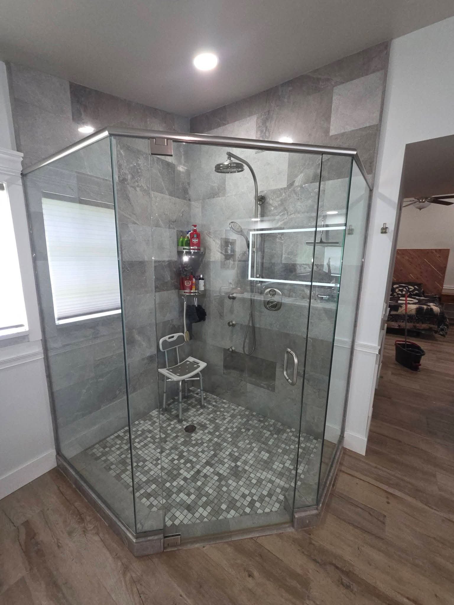 Glass shower enclosure cleaned streak-free